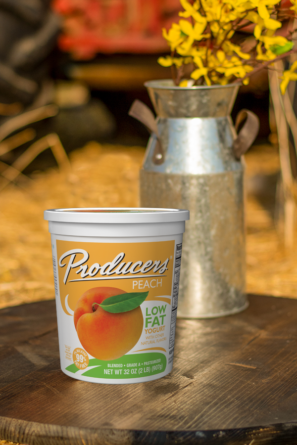 Producers Orange yogurt on a farm